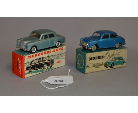 Two Tekno diecast model cars: #723 Mercedes-Benz 180 in metallic blue; #719 Morris Oxford in blue. Both boxed. (2)