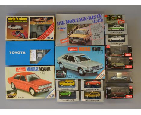 10 Schuco boxed diecast model cars together with 3 Schuco kits and two others. (15)