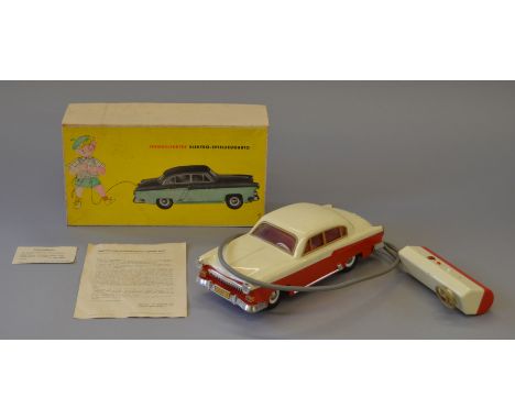 FERNGELENKTES ELEKTRO-SPIELZEUGAUTO. Plastic 'remote-control' model car. German. Circa 1965. Length 28cm approx. With origina