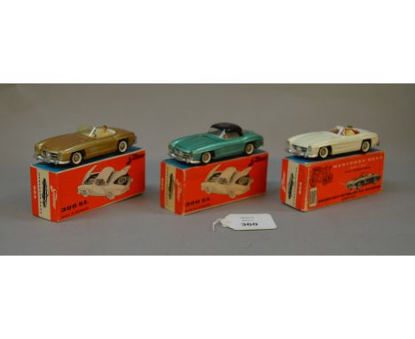 Three Tekno Mercedes-Benz 300SL: #924 in gold with white interior; #925 in green with black roof; #924 in white with red inte