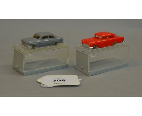 Two Lego System 1:87 scale plastic vehicles: 58 Opel Rekord in red and 17M Taunus Deluxe in grey. (2)