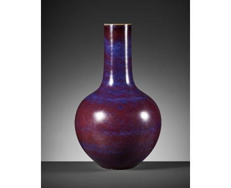 A LARGE FLAMBE-GLAZED TIANQIUPING, QING DYNASTYChina, 1644-1912. The globular body rising from a short tapered foot to a tall