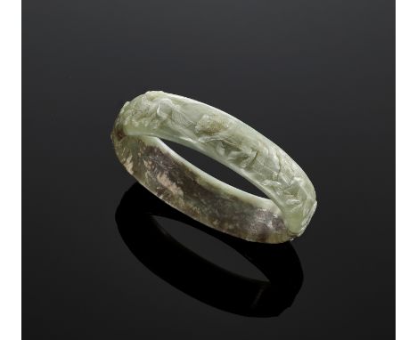 A CELADON JADE 'EIGHT HORSES OF MU WANG' BANGLE, QING DYNASTYChina, 18th-19th century. The exterior deftly carved in relief w