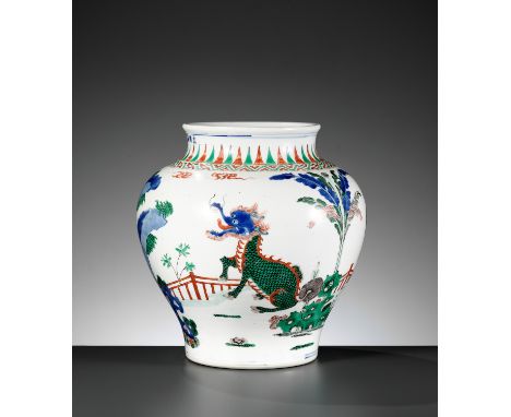 A WUCAI 'BEASTS' BALUSTER JAR, QING DYNASTYChina, 1644-1912. The sides rising from the slightly concave base to a waisted nec