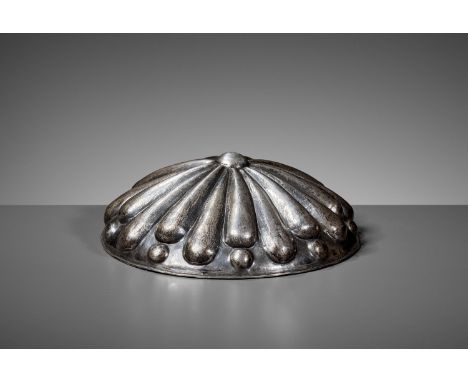 AN ACHAEMENID SILVER PHIALE, 6TH - 4TH CENTURY BCThe hammered shallow silver bowl decorated with a central boss encircled by 