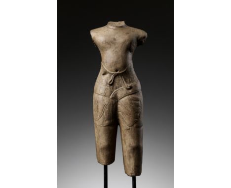 A SANDSTONE TORSO OF A MALE DEITY, BAPHUON STYLE, ANGKOR PERIODKhmer Empire, 11th century. The torso sensitively modeled wear