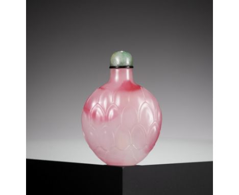 A CARVED PINK GLASS 'LOTUS' SNUFF BOTTLE, 18TH-19TH CENTURYChina. The compressed globular body rising from a short oval foot 