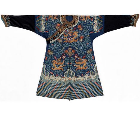 AN IMPERIAL EMBROIDERED BLUE-GROUND DRAGON ROBE, JIFU, QING DYNASTYChina, 19th century. The blue ground is worked in couched 