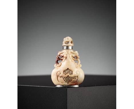 A RETICULATED SOAPSTONE SNUFF BOTTLE, 18TH-19TH CENTURYChina. Of flattened gourd form, intricately carved with openwork, rest