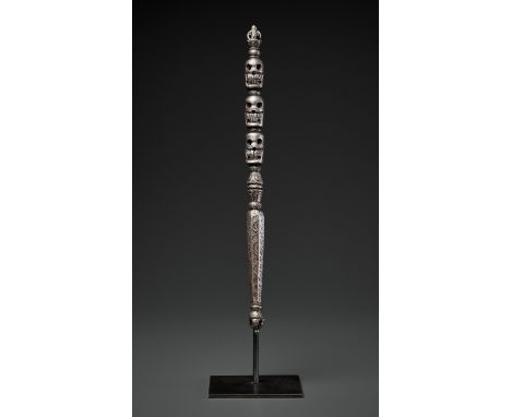 AN IRON RITUAL STAFF, KHATVANGA, 16TH-17TH CENTURYTibet. Well cast, the handle surmounted by a vajra above three citipati sku