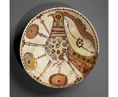 A LARGE SARI WARE SLIP-PAINTED POTTERY 'BIRD' BOWLNorthern Persia, 10th-11th century. With deep rounded sides supported on a 