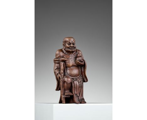 A BAMBOO FIGURE OF 'IRON CRUTCH LI', QING DYNASTYChina, 1644-1912. The immortal Li Tieguai finely carved standing, his raised