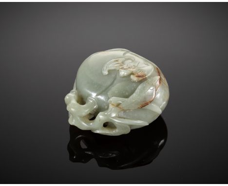 A DEEP CELADON AND RUSSET JADE 'PEACH AND BAT' GROUP, EARLY QING DYNASTYChina, 18th century. Carved from a heavy, single pebb