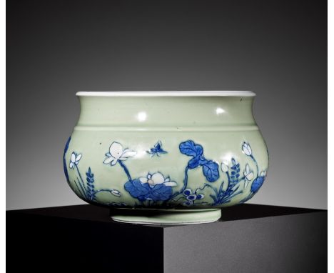 A BLUE AND WHITE CELADON-GROUND 'LOTUS POND' CENSER, KANGXI PERIODChina, 1662-1722. The compressed globular body rising from 