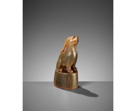 A RARE BUFFALO HORN 'XINIU' SEAL, EARLY QING DYNASTYChina, 17th-18th century. Of oval form, surmounted by a finely carved xin
