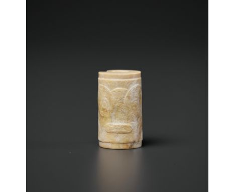 A CARVED CYLINDRICAL JADE BEAD, LIANGZHU CULTUREChina, circa 3300-2200 BC. The tubular bead is carved in form of a cylinder w