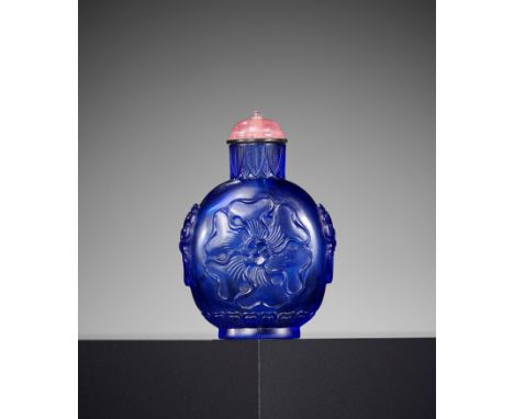 A BLUE GLASS 'MALLOW' SNUFF BOTTLE, QIANLONG MARK AND PERIODChina, 1736-1795. The ovoid sides rising from a short spreading f