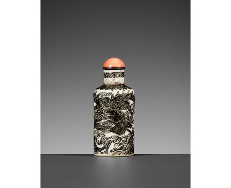 A PORCELAIN SNUFF BOTTLE WITH UNFIRED COBALT DECOR, 1800-1850China. Of cylindrical form with a straight neck and recessed bas