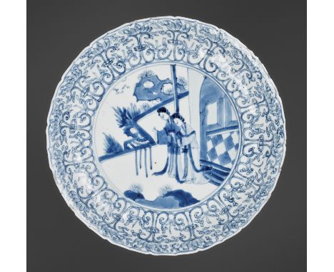 A BLUE AND WHITE 'LONG ELIZA' BARBED-RIM DISH, KANGXI PERIODChina, 1662-1722. The lobed shallow rounded sides rising from a s