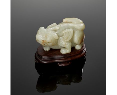 A PALE CELADON JADE 'BIXIE', LATE MING DYNASTYChina, 16th to 17th century. The beast's ears flicked back, bulging eyes above 