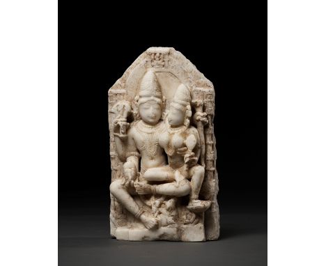 A WHITE MARBLE RELIEF OF UMA MAHESHVARA, 13TH-15TH CENTURYIndia. The divine couple seated in lalitasana on Shiva's mount Nand