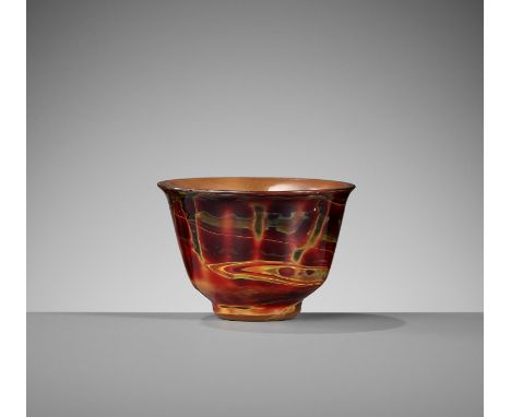 A SMALL GLASS 'REALGAR IMITATION' CUP, 18TH CENTURYChina. The deep rounded sides rising from a thick, tapered foot, with a ce