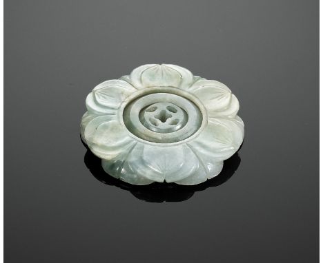 AN INTERLOCKING CELADON JADE LOTUS PENDANT, QING DYNASTYChina, 19th century. Finely carved in openwork from a single piece of