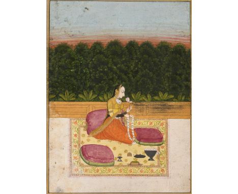 A MUGHAL MINIATURE PAINTING OF A PRINCESS ON A TERRACENorth India, Jodhpur, late 18th to early 19th century. Ink, gouache, an