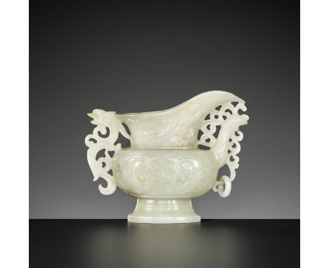 A PALE CELADON JADE 'PHOENIX' EWER, QING DYNASTYChina, 1644-1912. Crisply carved in shallow relief on both sides of the flatt