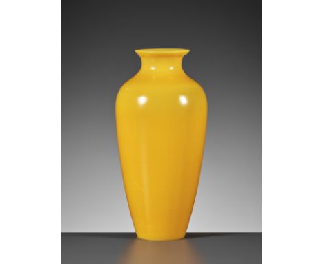 AN EGG-YOLK YELLOW PEKING GLASS VASE, LATE QING TO REPUBLIC PERIODChina, 1860-1940. Translucent at the upper part, the almost