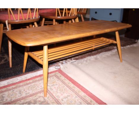 An Ercol model 398 elm top coffee table, top 41" x 17"