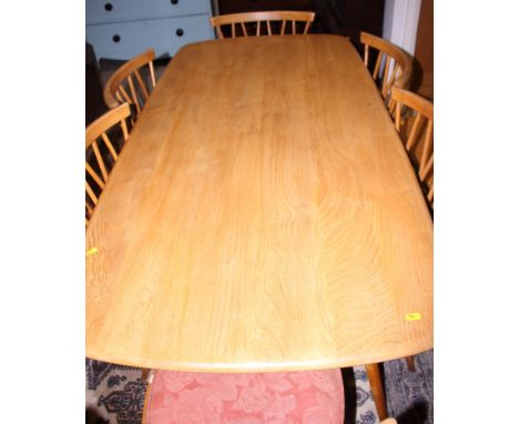 An Ercol elm and beech model 382 dining table, on splay supports, top 60" x 30"