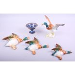 A set of three Beswick flying duck wall pockets, a Beswick model of a mallard and a Carltonware