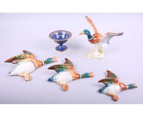 A set of three Beswick flying duck wall pockets, a Beswick model of a mallard and a Carltonware pedestal dish with gilt decor