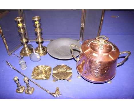 A two-handled brass and copper jar and cover, a brass firescreen, brass candlesticks and other metalware