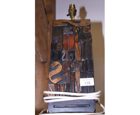 A lamp base formed from printing blocks