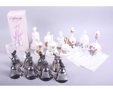 A limited edition Caithness crystal birthday bell, seven assorted ceramic bells and seven silvered metal bells