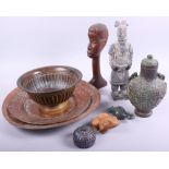 A Tang style ceramic figure of a man, two Middle Eastern copper dishes, a bronze bottle and other