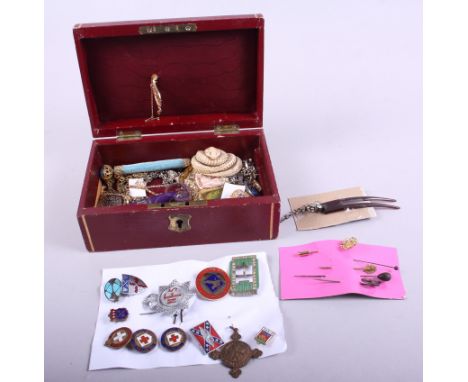 A red morocco leather jewellery box, containing a 9ct gold floral spray brooch, a number of enamelled badges, stick pins, var