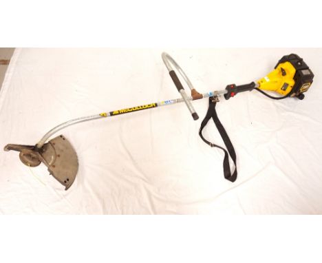 MCCULLOCH STRIMMERwith a two stroke pull start engine and shoulder harness 