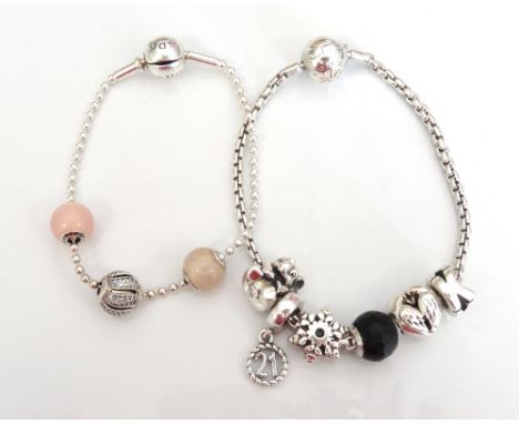 PANDORA SILVER ESSENCE CHARM BRACELETwith three Essence bead charms; and a Thomas Sabo Charm Club silver bracelet with five a