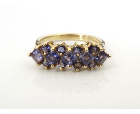 BLUE GEM SET CLUSTER RINGpossibly blueberry quartz, on nine carat gold shank, ring size M