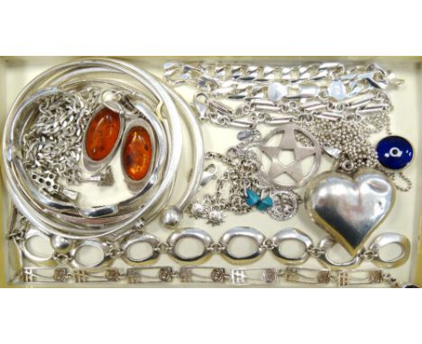 SELECTION OF SILVER JEWELLERYcomprising bangles and bracelets of various designs, a pair of amber set earrings, pendants and 