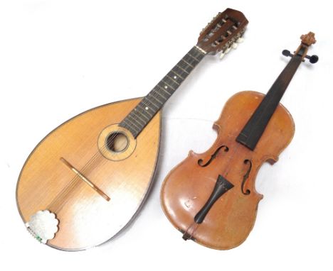 CHILD'S VIOLINpossibly German, 12.25" back excluding button with impressed mark Stainer and bearing a trade label Jacob Stain