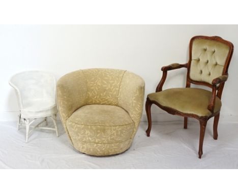 TUB CHAIRwith foliate pattern fabric covering, raised on small shaped metal feet; a stained wooden elbow chair, with carved f