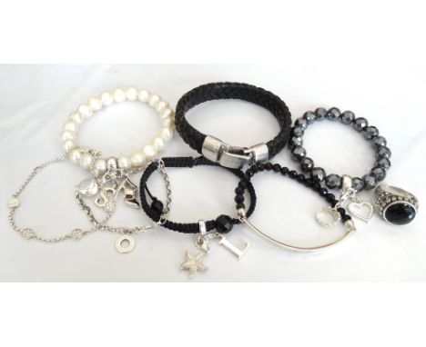 SELECTION OF THOMAS SABO JEWELLERYcomprising an onyx set silver skull ring; three Charm Club bracelets, one pearl with three 