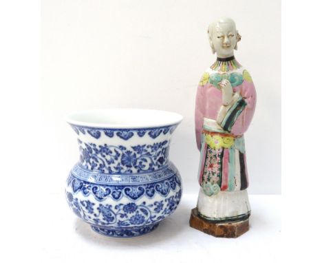 18th CENTURY CHINESE GLAZED PORCELAIN FEMALE FIGUREwearing traditional dress, 17.8cm high; and a later Chinese blue on white 