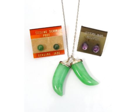 TWO JADE ANIMAL TOOTH SHAPED PENDANTSeach approximately 2.8cm high; together with a pair of jade stud earrings in silver and 