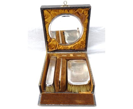 GEORGE V SILVER GENTLEMAN'S TRAVELLING GROOMING SETcomprising a circular mirror with stand, comb, hair brush and clothes brus