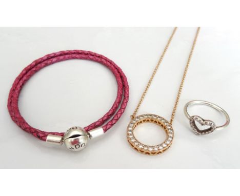 SELECTION OF PANDORA JEWELLERYcomprising a CZ set Hearts of Pandora necklace in rose colour; a pink Moments double woven leat
